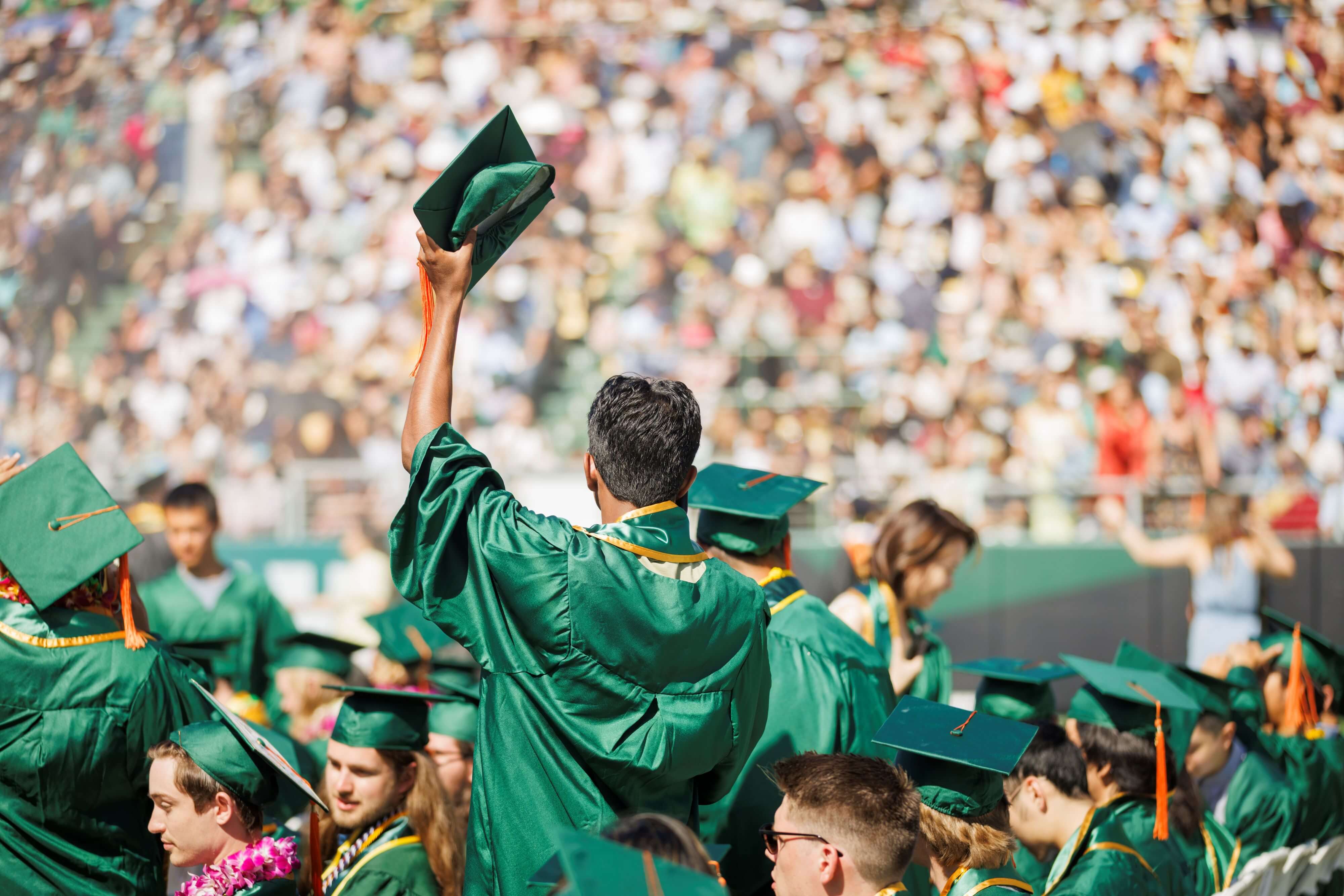 graduating college students celebrating