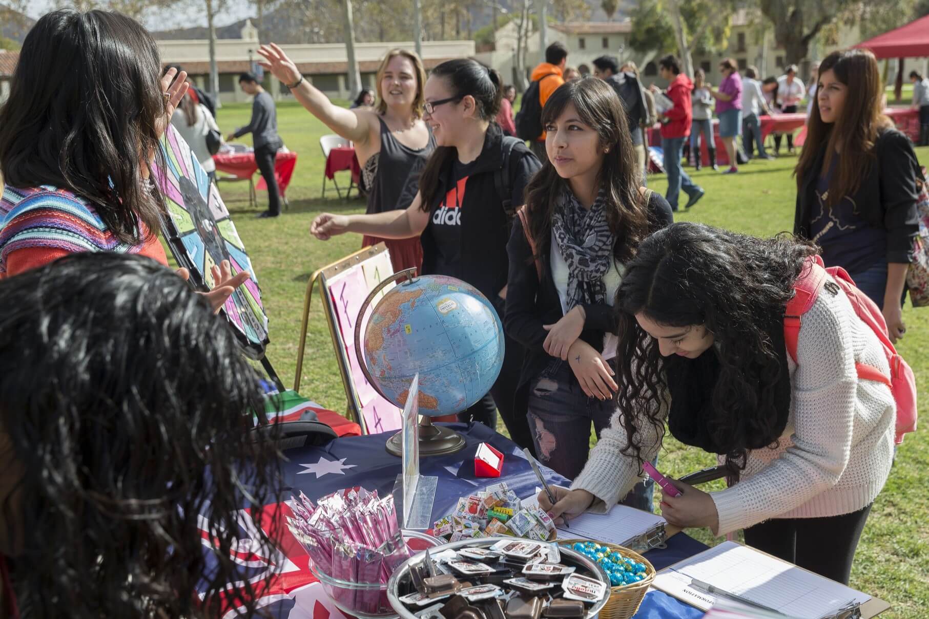 College students attend an international education fair in the quad