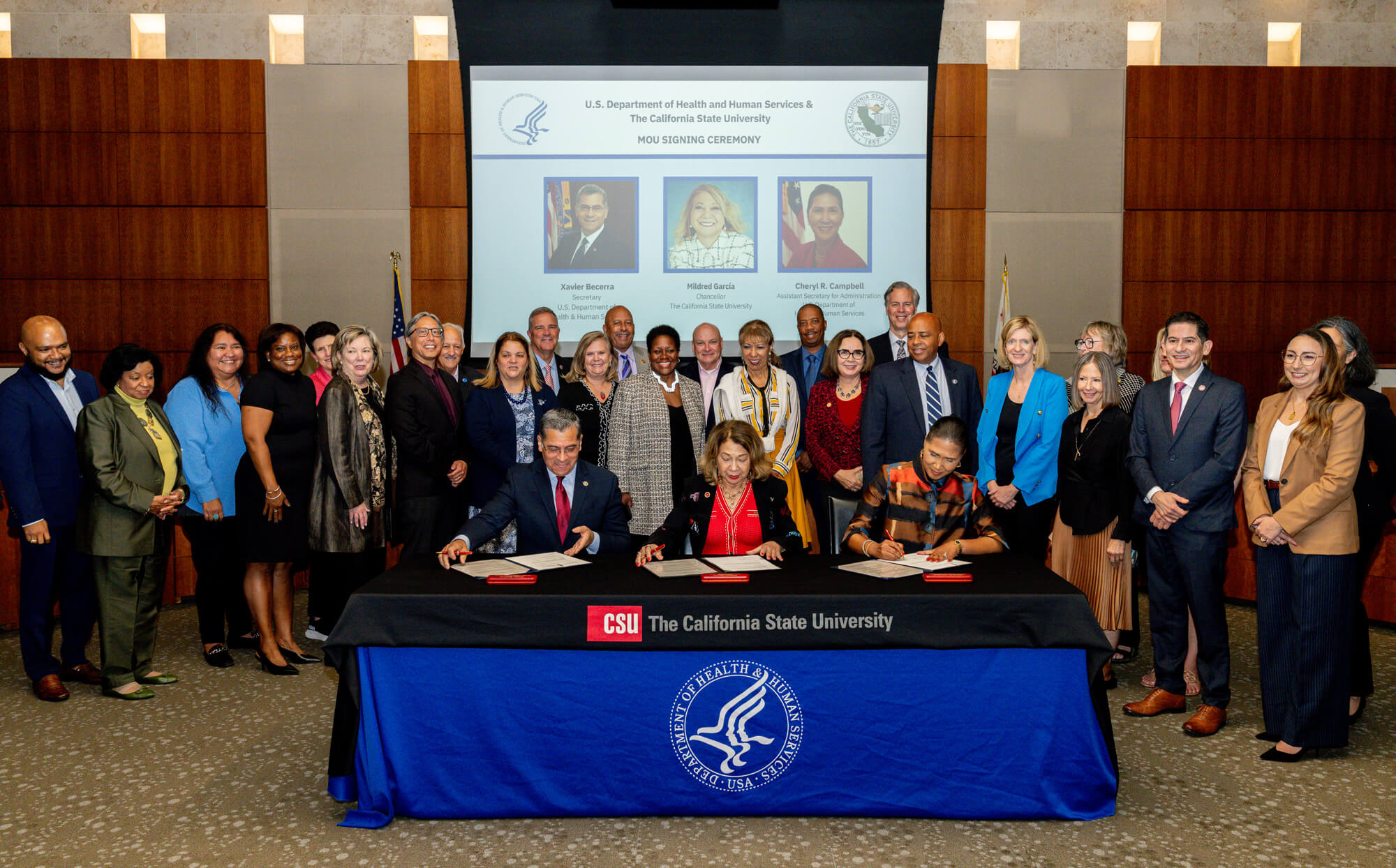 Xavier Becerra, Mildred Garcia, and Cheryl Campbell signing MOU