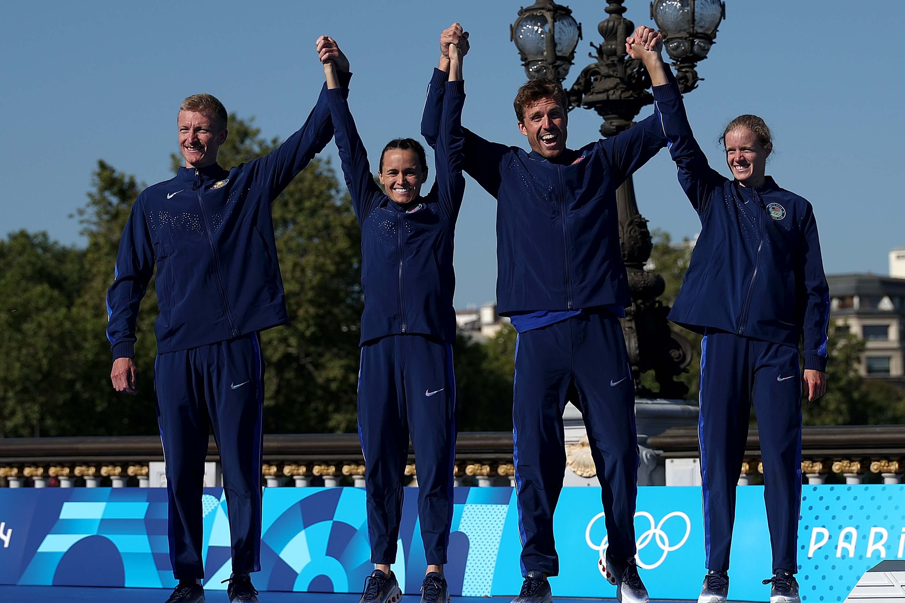 Taylor Spivey and her teammates on the podium after winning silver