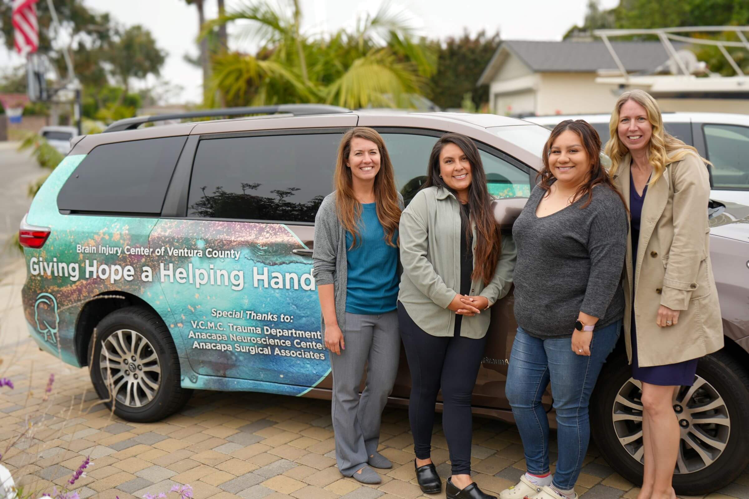 Brain Injury Center staff with vehicle