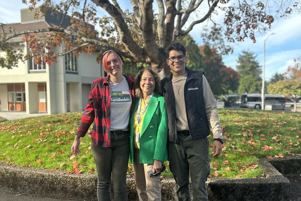 At Cal Poly Humboldt for the presidential search open forum on October 10, 2024, Chancellor García visited with students and alumni including Dakota (left) and José Juan (right).