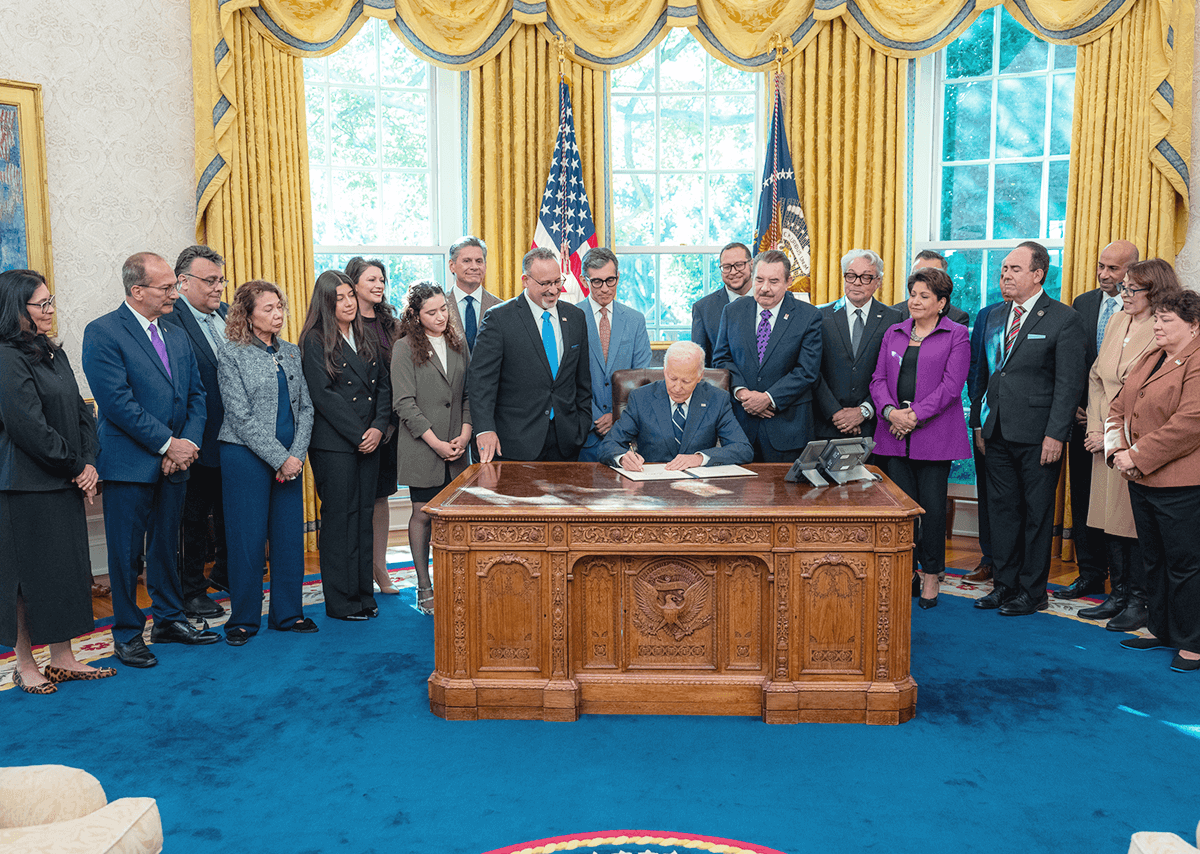 Chancellor Mildred García with President Joe Biden and Secretary of Education Miguel Cardona in the Oval Office.