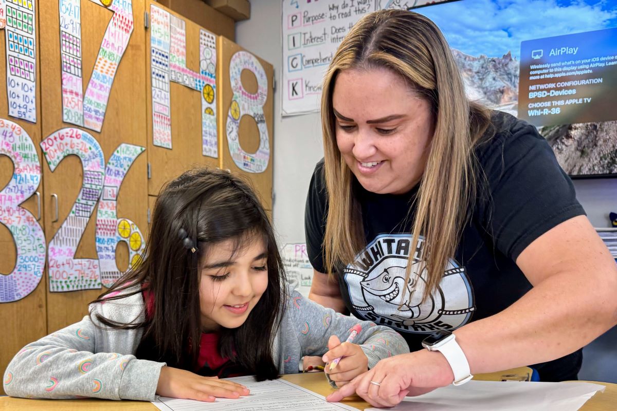 Suzanne Huerta with a young student